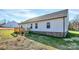View of the back of the house with a wood deck and vinyl siding at 6155 Long Branch Rd, Salisbury, NC 28147