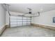 Spacious two car garage with an automatic door opener and painted concrete floor at 6155 Long Branch Rd, Salisbury, NC 28147