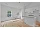Bright, white kitchen featuring an open floor plan connecting the dining area, and kitchen at 6155 Long Branch Rd, Salisbury, NC 28147