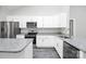 Modern kitchen featuring white cabinets, stainless steel appliances, and granite countertops at 6155 Long Branch Rd, Salisbury, NC 28147