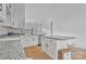 Bright, white kitchen featuring an open floor plan connecting the dining area, and kitchen at 6155 Long Branch Rd, Salisbury, NC 28147