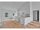 Bright, white kitchen featuring an open floor plan connecting the living room, dining area, and kitchen at 6155 Long Branch Rd, Salisbury, NC 28147