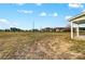 A spacious backyard offering great potential for landscaping, framed by picturesque neighborhood homes at 11507 Valley Oaks Ln, Stanfield, NC 28163