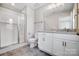 Inviting bathroom features a glass-enclosed shower, vanity with ample storage, and modern finishes at 11507 Valley Oaks Ln, Stanfield, NC 28163