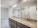 A bathroom featuring double sinks, granite counters, large mirror, with a shower and tub at 11507 Valley Oaks Ln, Stanfield, NC 28163