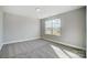 Bedroom with plush carpet, a large window offering lots of natural light at 11507 Valley Oaks Ln, Stanfield, NC 28163