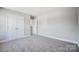 Bright bedroom offers great closet space and a serene atmosphere perfect for relaxation and restful sleep at 11507 Valley Oaks Ln, Stanfield, NC 28163
