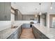 Modern kitchen featuring granite countertops, stainless steel appliances, stylish cabinets, and a functional central island at 11507 Valley Oaks Ln, Stanfield, NC 28163