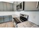 Modern kitchen featuring granite countertops, stainless steel appliances, stylish cabinets, and stainless steel electric range at 11507 Valley Oaks Ln, Stanfield, NC 28163