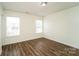 Bright bedroom with hardwood floors and neutral walls at 2327 Hope Valley Ln, Charlotte, NC 28213