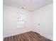 Cozy bedroom with hardwood floors and a window at 2327 Hope Valley Ln, Charlotte, NC 28213