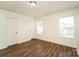 Well-lit bedroom with hardwood floors and neutral walls at 2327 Hope Valley Ln, Charlotte, NC 28213
