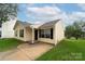 Ranch style home with a well-maintained lawn at 2327 Hope Valley Ln, Charlotte, NC 28213