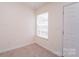 Bright, compact kitchen with a window and neutral walls at 2327 Hope Valley Ln, Charlotte, NC 28213