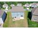 Aerial view of the home's backyard featuring a patio and fire pit at 3023 Spinner Ct, Denver, NC 28037