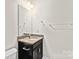 Bathroom with granite vanity, black cabinets, and white toilet at 3023 Spinner Ct, Denver, NC 28037