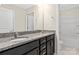Bathroom featuring a dual sink vanity with granite counters, mirror and framed doors at 3023 Spinner Ct, Denver, NC 28037