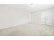 Neutral bedroom with carpet flooring, double door closet and ample space at 3023 Spinner Ct, Denver, NC 28037