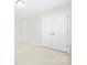 Bedroom with carpet flooring, double door closet, and neutral walls creates a calming atmosphere at 3023 Spinner Ct, Denver, NC 28037