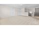 Bonus room features neutral carpet and white trim, doors, and base molding at 3023 Spinner Ct, Denver, NC 28037