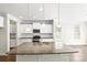 Spacious kitchen with granite island, stainless steel appliances, and modern pendant lighting at 3023 Spinner Ct, Denver, NC 28037