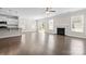 Spacious open-concept living area with fireplace, kitchen, and hardwood flooring throughout at 3023 Spinner Ct, Denver, NC 28037