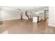 Open-concept living space with hardwood floors, stairs, and ample natural light at 3023 Spinner Ct, Denver, NC 28037