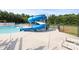 Community waterslide next to the pool, surrounded by a green treeline at 3023 Spinner Ct, Denver, NC 28037