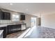 Modern kitchen with dark cabinetry, granite counters, and stainless steel appliances at 7741 Marlette Ln, Sherrills Ford, NC 28673