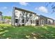 Back exterior showcasing a manicured lawn and outdoor living spaces, complete with a fire pit area at 2016 Cedar Falls Dr # 7, Waxhaw, NC 28173