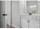 Bathroom featuring a white vanity and a door to the room's toilet and shower at 2016 Cedar Falls Dr # 7, Waxhaw, NC 28173