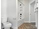 Bathroom featuring a bathtub with shower and a toilet with wrapped paper at 2016 Cedar Falls Dr # 7, Waxhaw, NC 28173