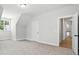 Spacious bedroom showcasing neutral walls, carpet, a window and a door to the home's hallway at 2016 Cedar Falls Dr # 7, Waxhaw, NC 28173