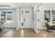 Bright and welcoming foyer with elegant white trim, hardwood floors, and views of the front yard at 2016 Cedar Falls Dr # 7, Waxhaw, NC 28173