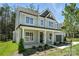 Beautiful two-story home with a covered front porch and well-maintained landscaping, surrounded by lush trees at 2016 Cedar Falls Dr # 7, Waxhaw, NC 28173