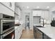 Modern kitchen with stainless steel appliances, island, and open layout at 2016 Cedar Falls Dr # 7, Waxhaw, NC 28173