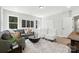 Inviting living room with a large sofa, trendy chairs, and decor at 2016 Cedar Falls Dr # 7, Waxhaw, NC 28173