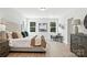 Spacious main bedroom features ample natural light, neutral decor, and sleek flooring at 2016 Cedar Falls Dr # 7, Waxhaw, NC 28173