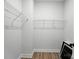 Simple walk-in closet features wire shelving and ample storage for organization at 2016 Cedar Falls Dr # 7, Waxhaw, NC 28173