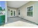 Covered back porch with outdoor lighting and french doors at 14447 Waterlyn Dr, Charlotte, NC 28278