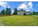 Spacious backyard with lush green lawn and privacy fence at 14447 Waterlyn Dr, Charlotte, NC 28278