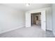 A bedroom shows a door to the hallway and the upper level at 14447 Waterlyn Dr, Charlotte, NC 28278