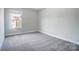Bright bedroom featuring a window with views at 14447 Waterlyn Dr, Charlotte, NC 28278
