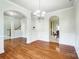 Spacious dining room with hardwood floors and arched doorways at 14447 Waterlyn Dr, Charlotte, NC 28278