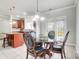 A dining area includes a glass table with four chairs, with access to the kitchen and backyard at 14447 Waterlyn Dr, Charlotte, NC 28278