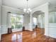 Bright dining area with large windows and elegant chandelier at 14447 Waterlyn Dr, Charlotte, NC 28278