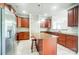 Kitchen with granite countertops, center island, stainless steel appliances and tile floor at 14447 Waterlyn Dr, Charlotte, NC 28278