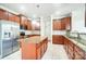 Well-lit kitchen with granite countertops and stainless steel appliances at 14447 Waterlyn Dr, Charlotte, NC 28278