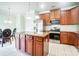 Open kitchen features a kitchen island, stainless steel appliances, and granite countertops at 14447 Waterlyn Dr, Charlotte, NC 28278