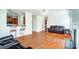 Open-concept living room features hardwood flooring, neutral paint, and lots of space at 14447 Waterlyn Dr, Charlotte, NC 28278